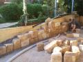 Dudley Outdoor Room With Sandstone Walls, Travertine Paving And Steps